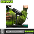 Zoso Music Shure MV6 USB gaming microphone on a desktop stand with a person in a green sweater in the background