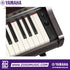 Close-up of the Zoso Music Yamaha Arius YDP-166 digital piano control panel with volume knob and weighted keys.