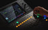 Zoso Music Yamaha DM3S 22-channel digital mixer with 9-inch touchscreen and motorized faders being operated by hand