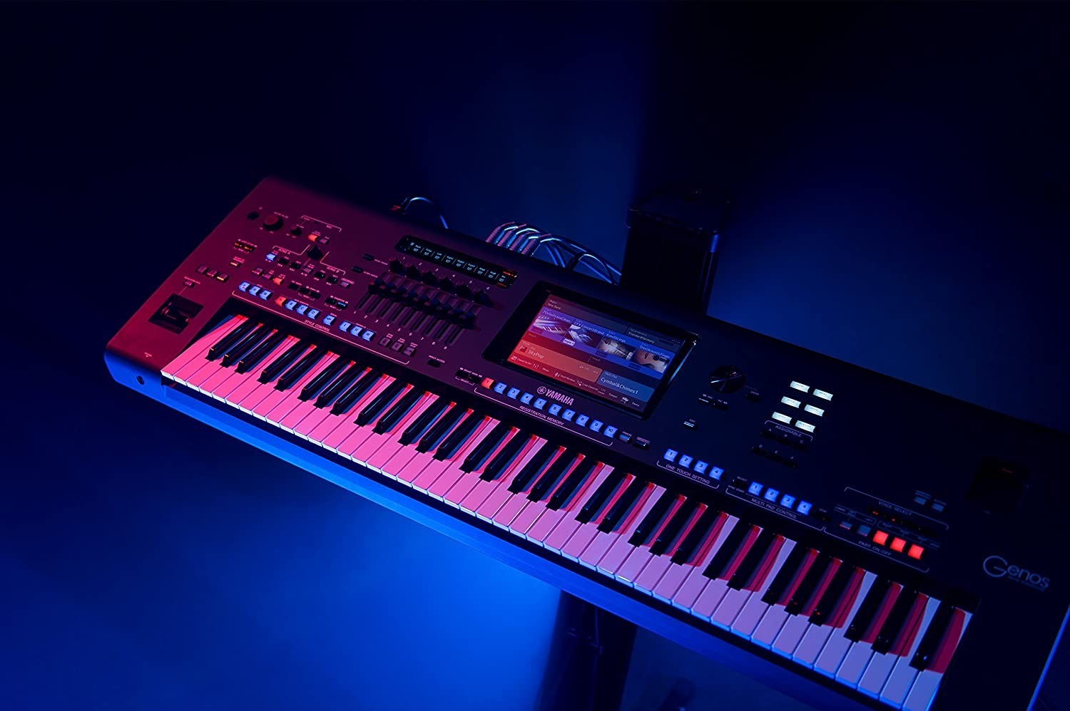 Zoso Music Yamaha Genos2 76-key arranger workstation with touchscreen and illuminated controls in a dark studio