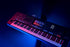 Zoso Music Yamaha Genos2 76-key arranger workstation with touchscreen and illuminated controls in a dark studio