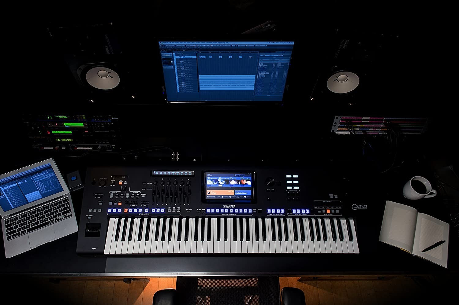 Zoso Music Yamaha Genos2 76-key arranger workstation in a professional studio setup with laptop and monitors