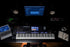 Zoso Music Yamaha Genos2 76-key arranger workstation in a professional studio setup with laptop and monitors