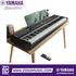 Zoso Music Yamaha P-525 88-key black digital piano with GrandTouch-S wooden keys on a wooden table with sustain pedal